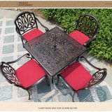 Bronze Color and White Color Arm Chairs and Table Used for Garden and Seaside