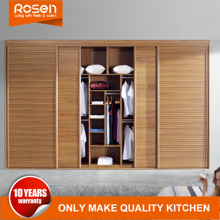 Oak Wood Sliding Doors to Closets in Bedroom