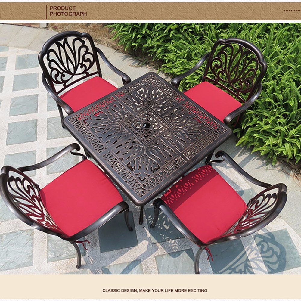 Bronze Color and White Color Arm Chairs and Table Used for Garden and Seaside